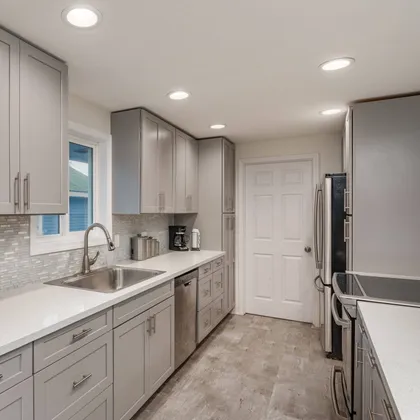 Modern kitchen with light gray cabinets
