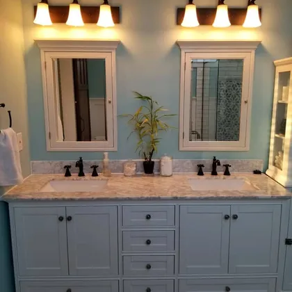Double sink bathroom vanity with sconces