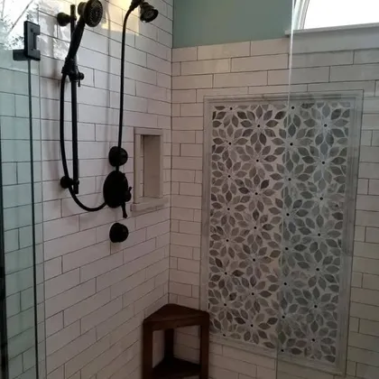 Tiled shower with dark hardware