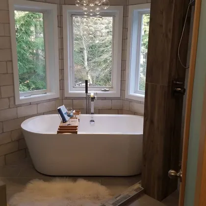 Bathroom with tub in bay window alcove