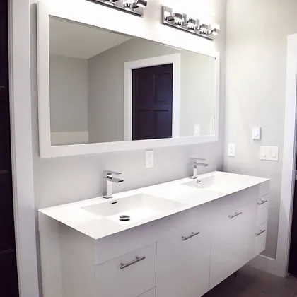 White double vanity with mirrors and lighting