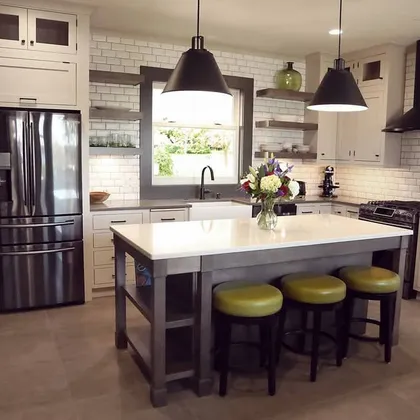 Kitchen with farmhouse table and range hood