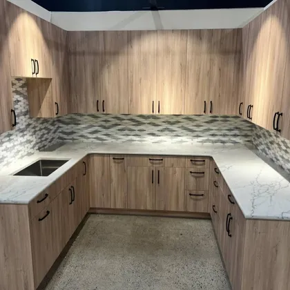 Elegant kitchen with wooden cabinetry and U-shaped layout