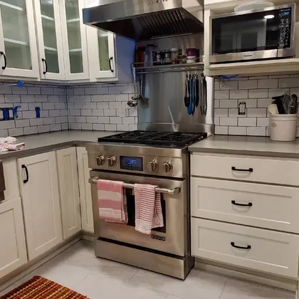 Modern kitchen with horizontal cabinet lines and stone countertop