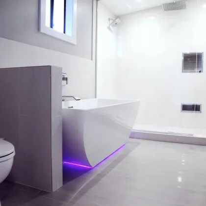 Contemporary bathroom with purple accent lighting